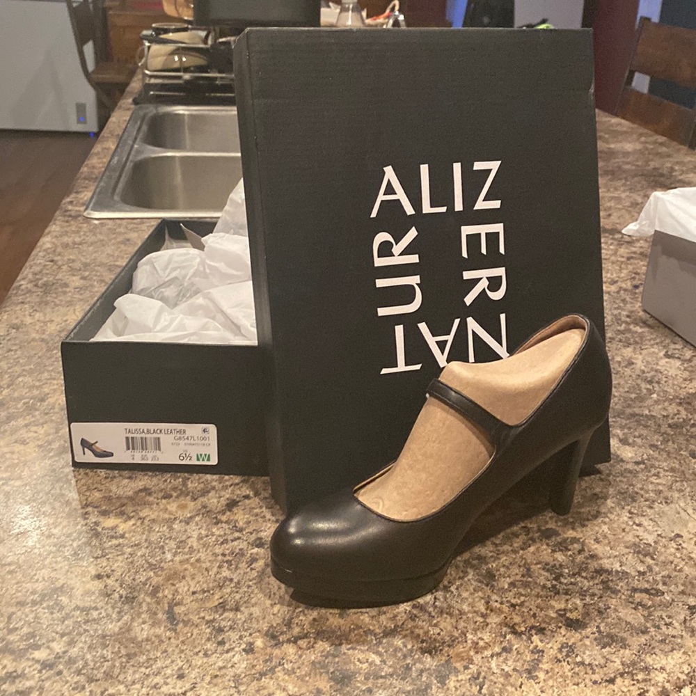 Never worn.   Still in wrap.   Mary Jane style heels from Naturalizer